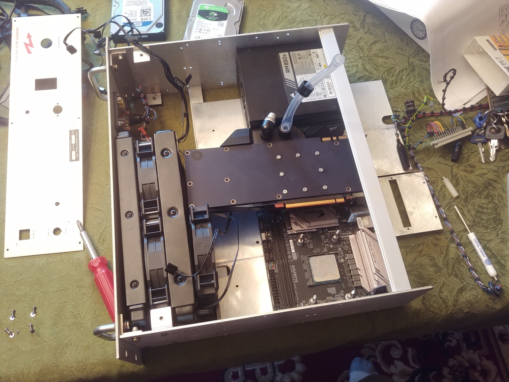 GPU, PSU, Motherboard, and radiator position mockup in the gutted power supply case.