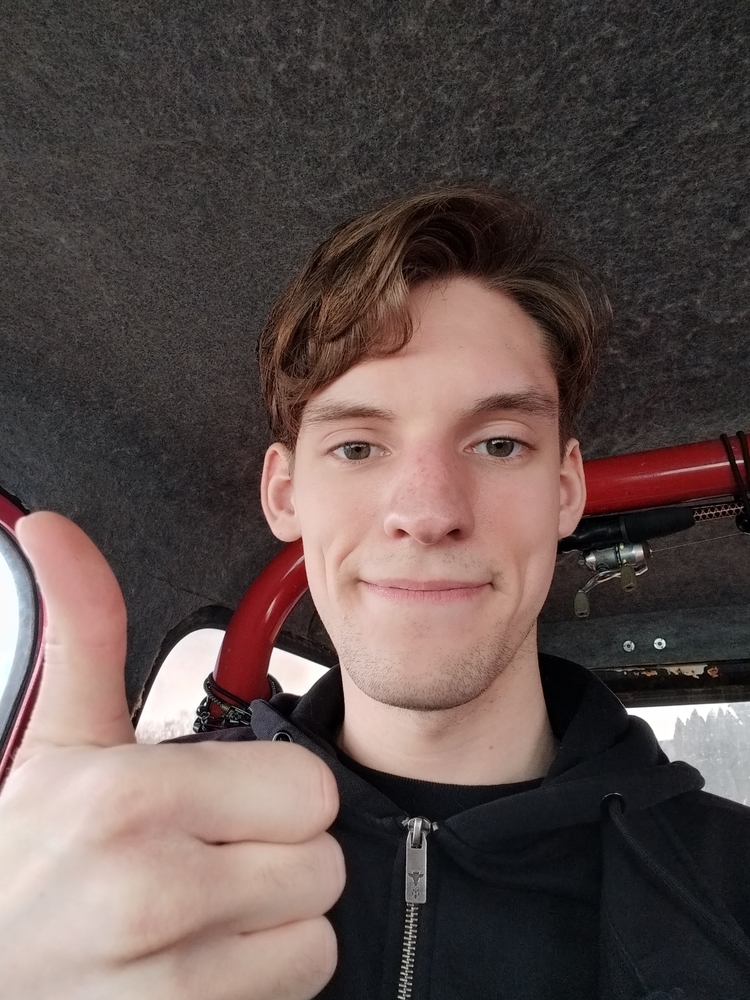 Me sitting in the Jeep after the haircut.