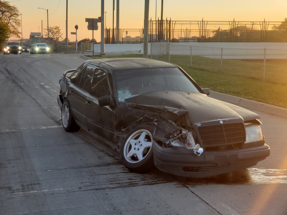 My modified Mercedes-Benz 300E with siginificant front passenger side impact damage.